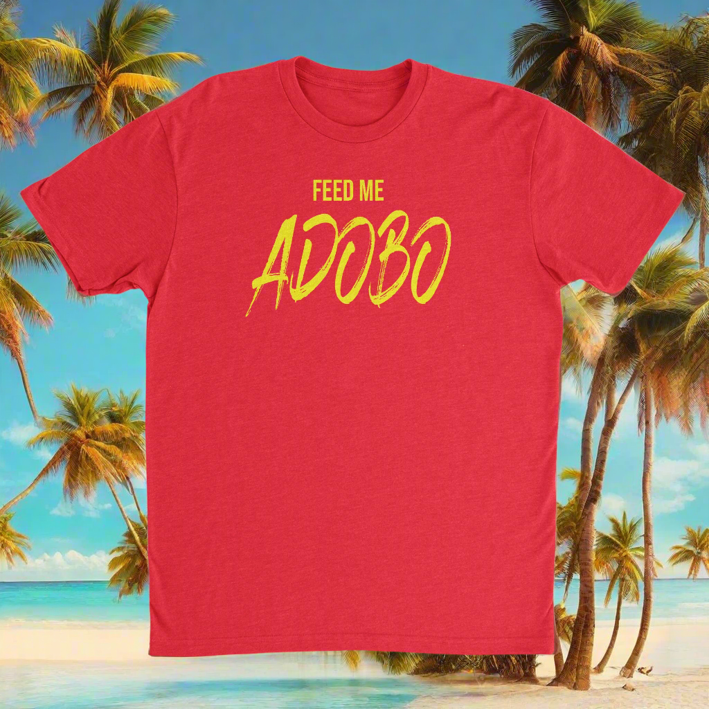 A red crew neck t-shirt with the text 'FEED ME ADOBO' printed in yellow.