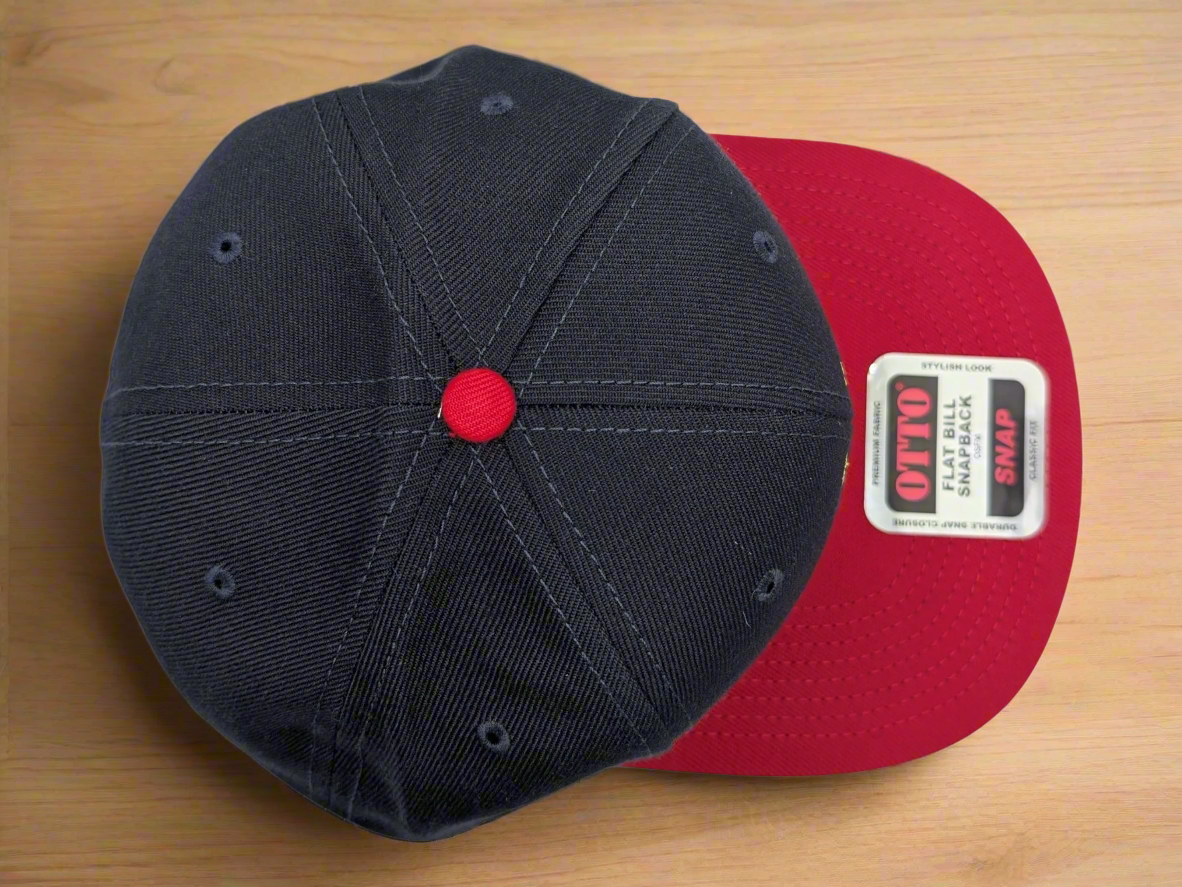 Black and red cap with a visible brand label on a white background
