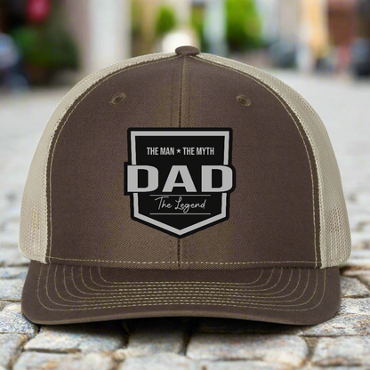 Brown and beige cap with 'DAD' text on a white background