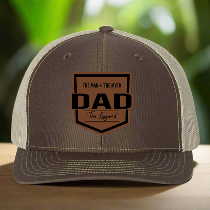 Brown and beige cap with 'DAD' text on a white background