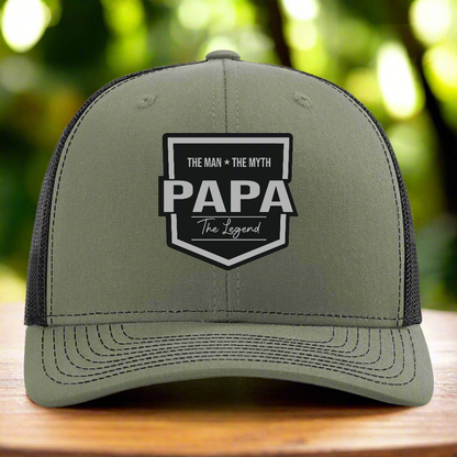 Green cap with 'PAPA' text and design on a white background