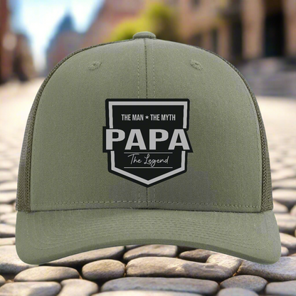 Green cap with 'PAPA' text and design on a white background