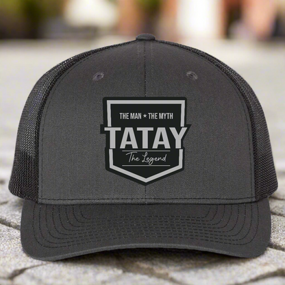 Gray trucker cap with 'TATAY' logo on a white background