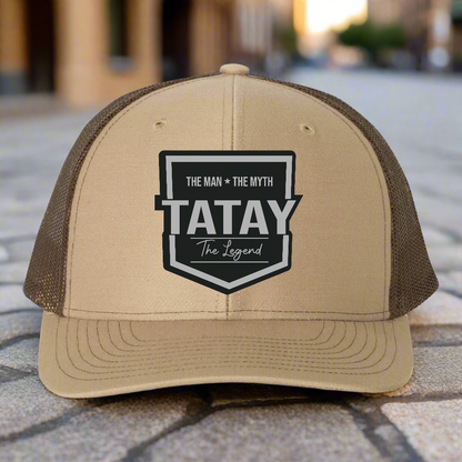 Beige and brown trucker hat with 'TATAY' logo on a white background
